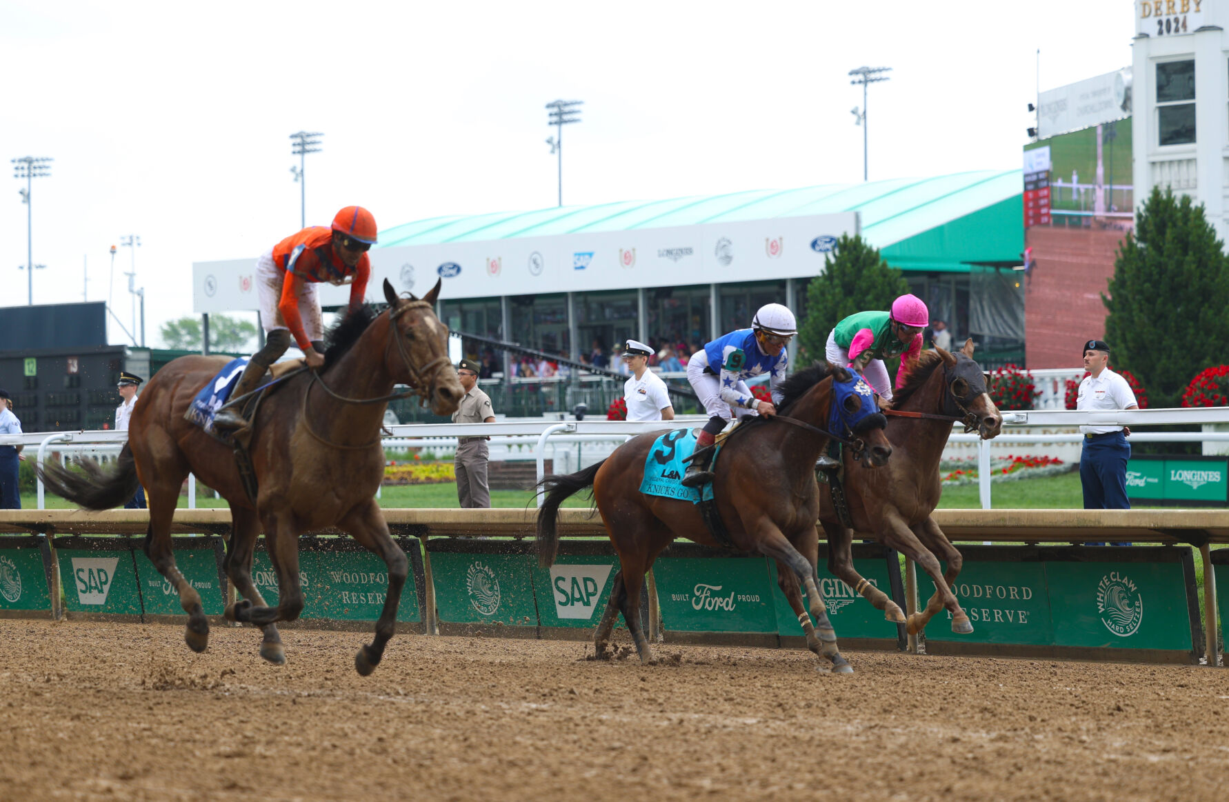 Two horses near finish line.JPG